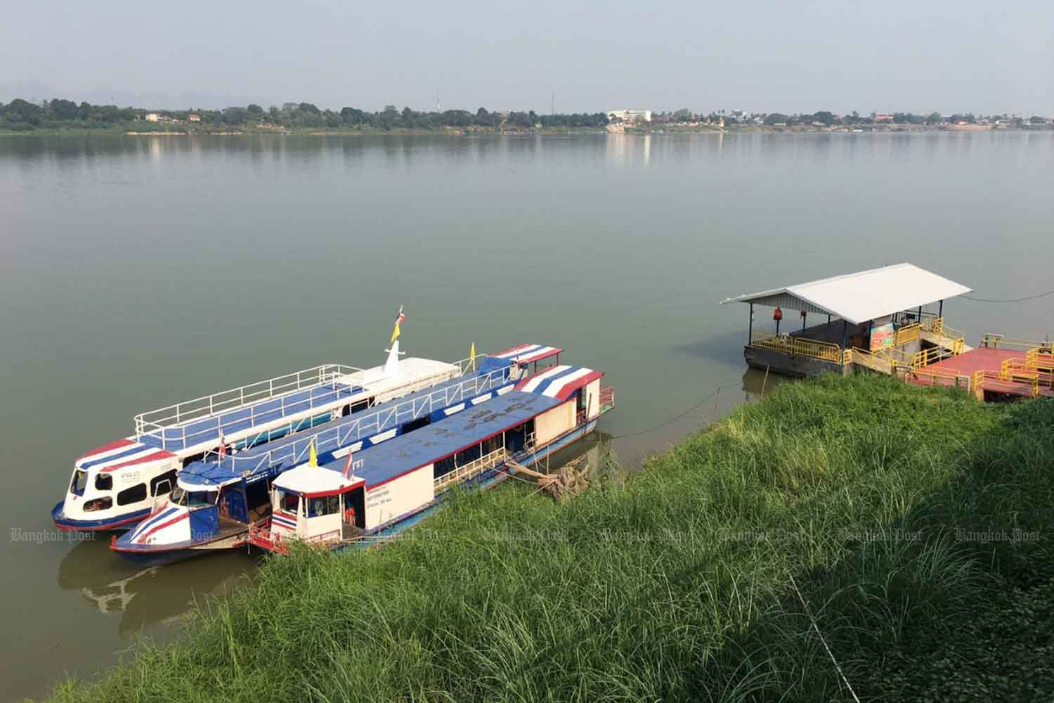 Passenger boats moor at a pier in Nakhon Phanom's Muang district. Boat services across the Mekong river between Thailand and Laos in Nakhon Phanom have come to a halt after the border was closed.