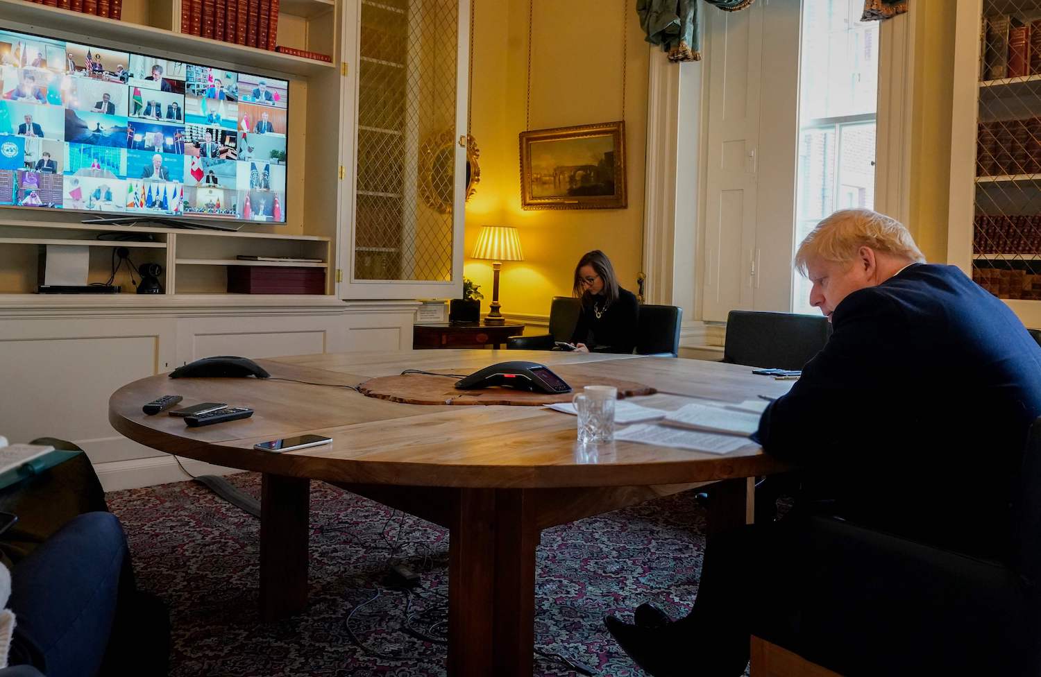 Prime Minister Boris Johnson participates in a video conference with other G20 leaders in the study of 10 Downing Street in London on Thursday. (Handout photo via AFP)