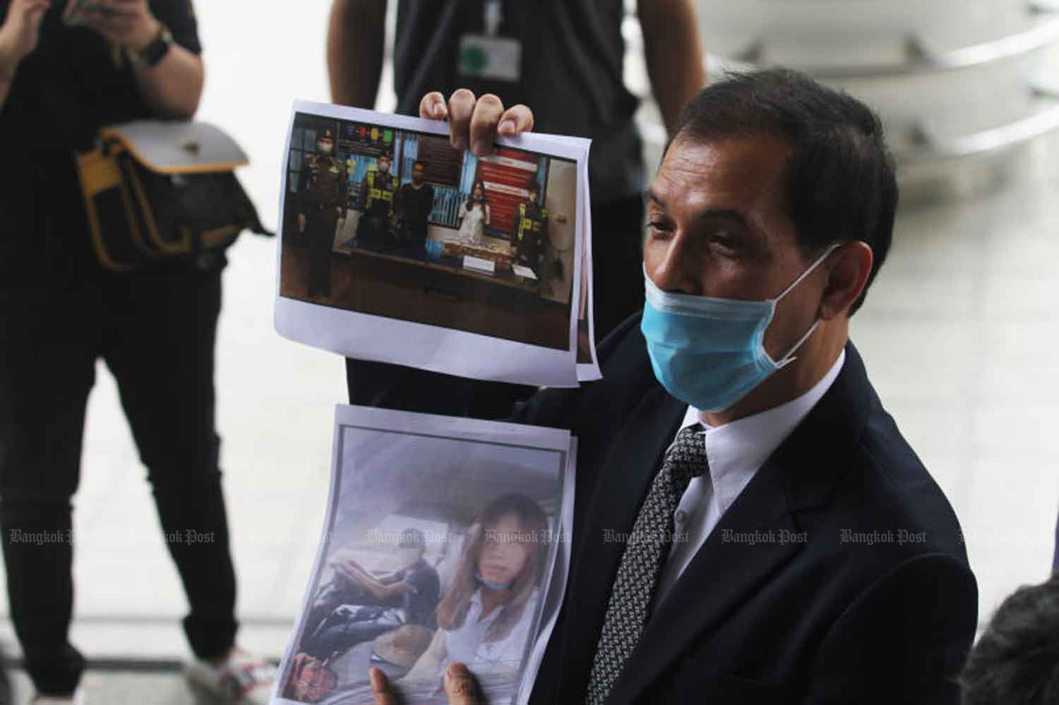 Lawyer Ananchai Chaidej shows pictures of two Myanmar suspects after their arrest. Nutthawat Wicheanbut Lawyer Ananchai Chaidej shows pictures of two Myanmar suspects after their arrest. Nutthawat Wicheanbut