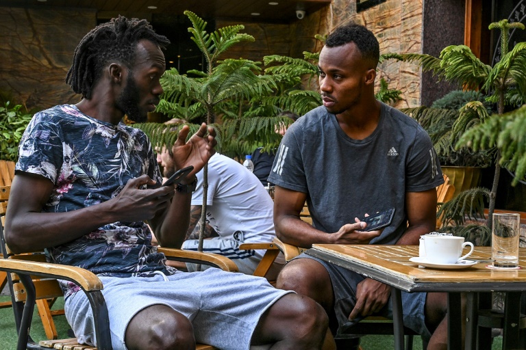 Real Kashmir players Armand Bazie (left) and Gnohere Krizo of Ivory Coast talk in their Srinagar hotel restaurant during the coronavirus lockdown Real Kashmir players Armand Bazie (left) and Gnohere Krizo of Ivory Coast talk in their Srinagar hotel restaurant during the coronavirus lockdown