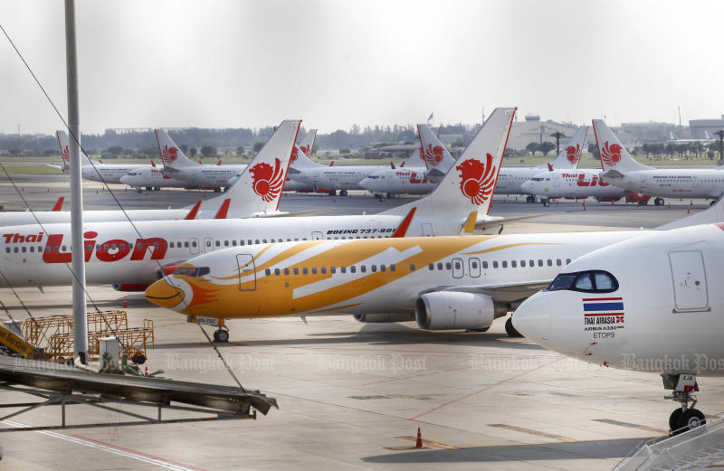 Thai Lion Air planes are among aircraft seen parked on the tarmac of Don Mueang airport after the airline suspended flights. (Photo by Pattarapong Chatpattarasill)