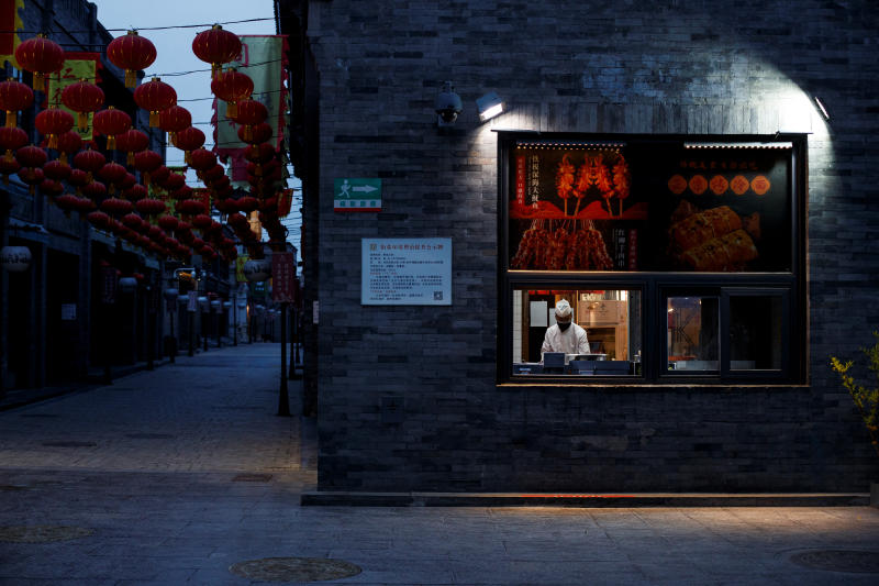 A chef prepares food in the Qianmen district, one of the top tourist destinations in Beijing, as the spread of the novel coronavirus disease continues in China on April 8, 2020. (Reuters photo)