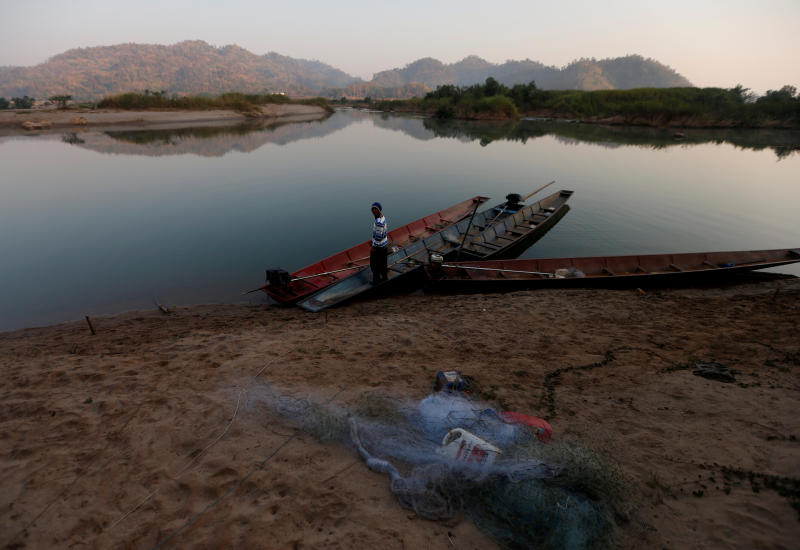 A fisherman is seen on the Mekong River bank outside Nong Khai on Jan 10, 2020. (Reuters photo) A fisherman is seen on the Mekong River bank outside Nong Khai on Jan 10, 2020. (Reuters photo)