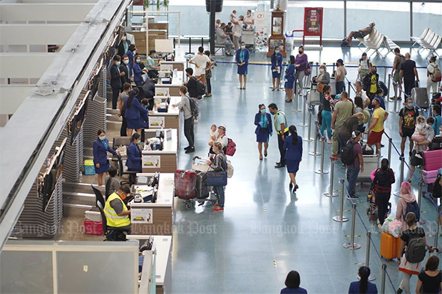 Foreigners being repatriated home wait at check-in for one of the few outbound flights allowed at Phuket airport, on May 2. The airport has been closed to all incoming commercial flights since April 3. (Phuket airport Facebook account)