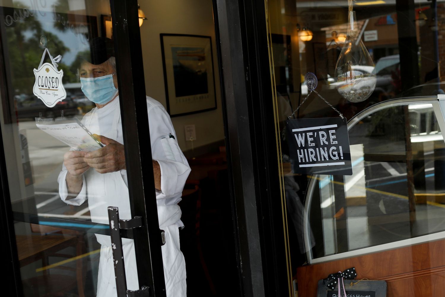 A 'We're Hiring' sign advertising jobs is seen at the entrance of a restaurant, as Miami-Dade County eases some of the lockdown measures put in place during the coronavirus disease outbreak, in Miami, Florida, on May 18. (Reuters photo) A 'We're Hiring' sign advertising jobs is seen at the entrance of a restaurant, as Miami-Dade County eases some of the lockdown measures put in place during the coronavirus disease outbreak, in Miami, Florida, on May 18. (Reuters photo)