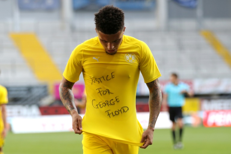 Protest: Dortmund's English star Jadon Sancho shows a Protest: Dortmund's English star Jadon Sancho shows a