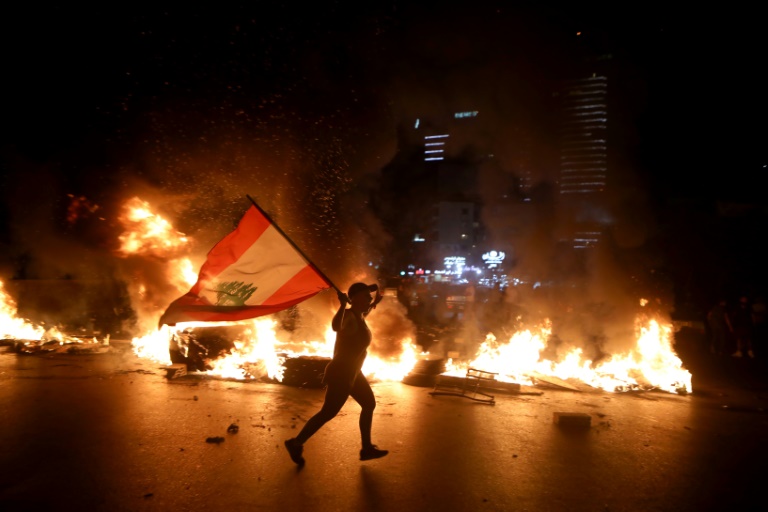 Lebanese protesters angered by a growing economic crisis set tyres on fire and blocked roads Lebanese protesters angered by a growing economic crisis set tyres on fire and blocked roads