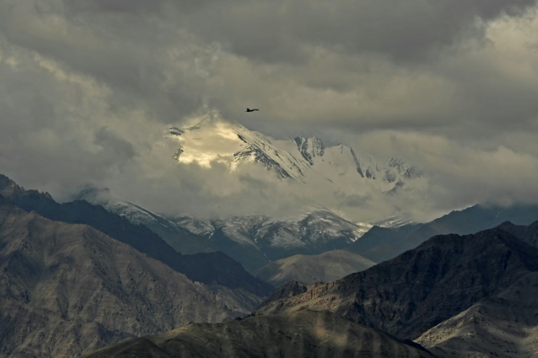 An Indian fighter jet flies over Leh, the joint capital of the union territory of Ladakh, on June 25, 2020, part of a show of strength after a border showdown between Delhi and Beijing. An Indian fighter jet flies over Leh, the joint capital of the union territory of Ladakh, on June 25, 2020, part of a show of strength after a border showdown between Delhi and Beijing.