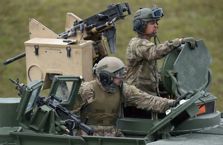 The move will cut the current US troop level in Germany from about 34,500 to 25,000, President Donald Trump's stated goal (US troops pictured near Grafenwoehr, Germany in 2017) The move will cut the current US troop level in Germany from about 34,500 to 25,000, President Donald Trump's stated goal (US troops pictured near Grafenwoehr, Germany in 2017)