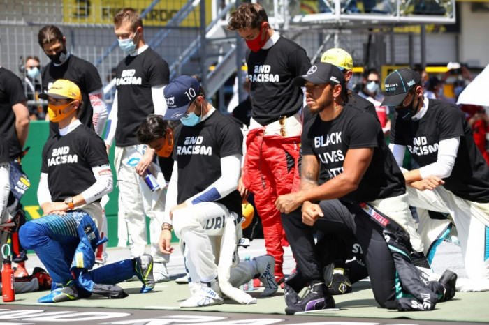 'It's about equality, not politics,' says Hamilton as six drivers refuse to take knee