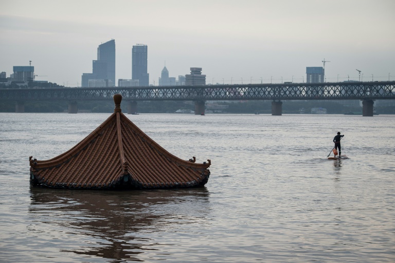 Chinese rivers and lakes swell perilously as summer flood season crests