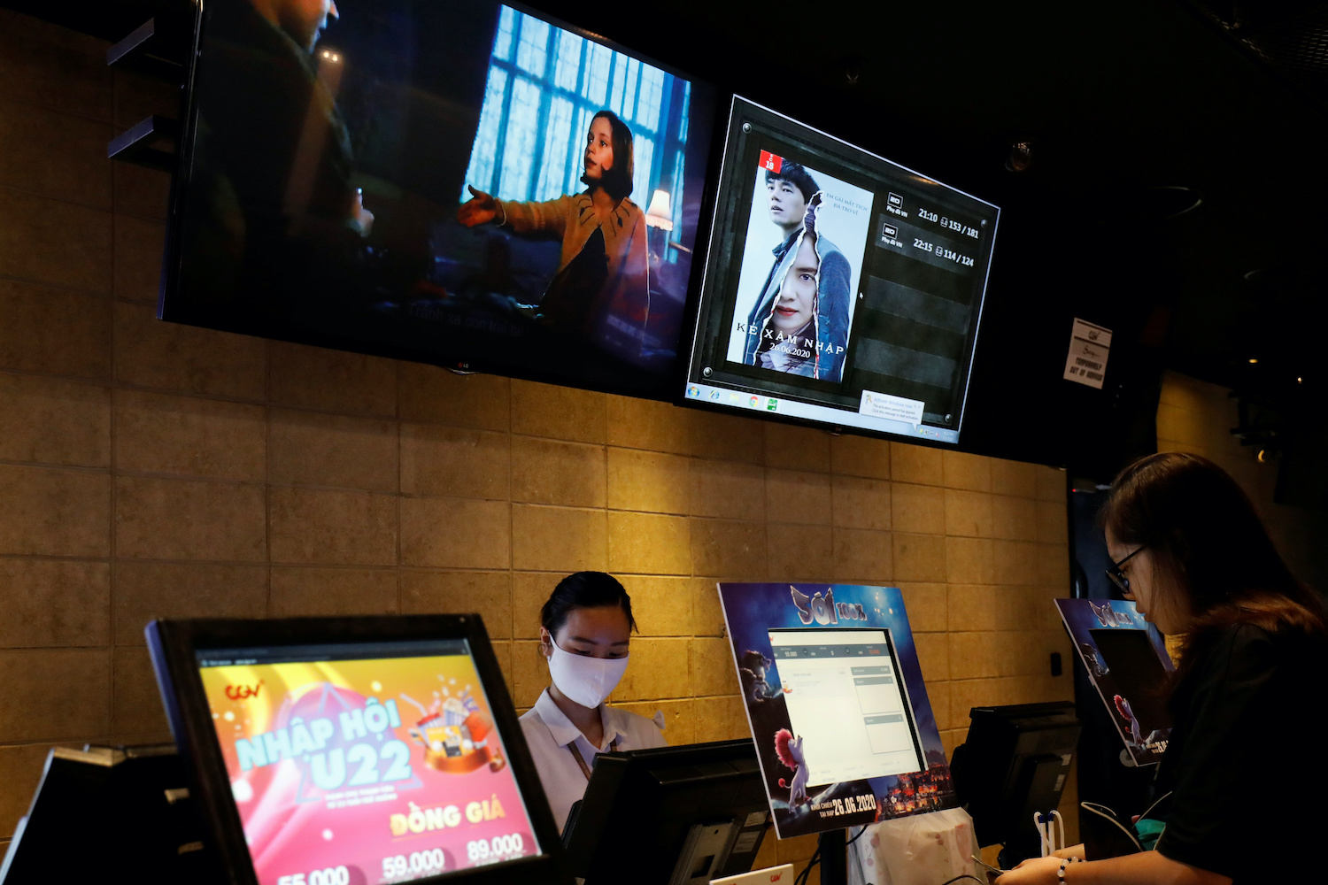 A staff member sells tickets at a CGV cinema at the Times City complex in Hanoi. (Reuters Photo)