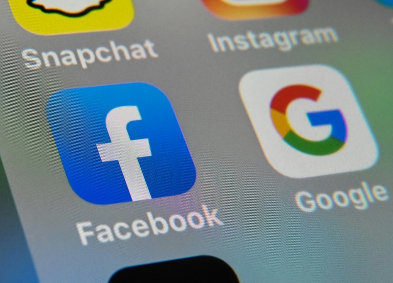 Australia unveils law forcing tech giants to pay for news