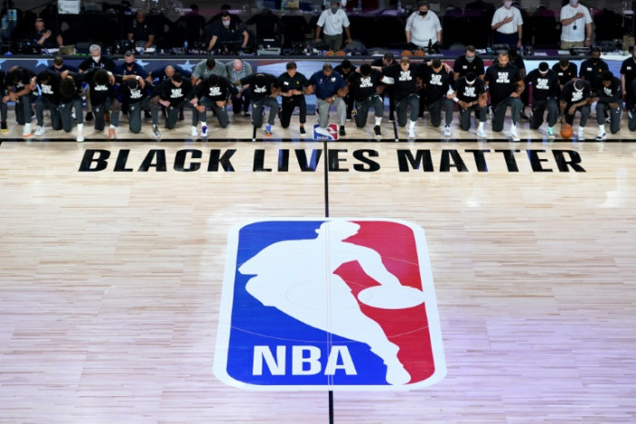 Players kneel during anthem as NBA restarts in Florida