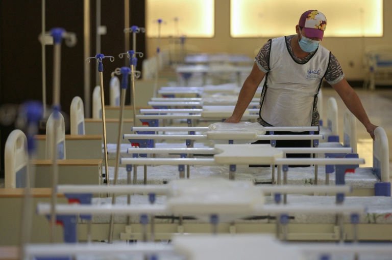 An Iraqi volunteer works on building a 525-bed field hospital at a Baghdad exhibition centre in June to help fight the coronavirus outbreak An Iraqi volunteer works on building a 525-bed field hospital at a Baghdad exhibition centre in June to help fight the coronavirus outbreak