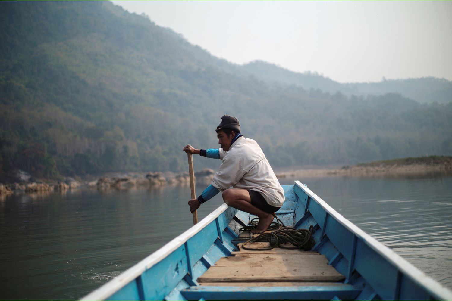 A local villager drives a boat where the future site of the Luang Prabang dam will be on the Mekong River, outskirt of Luang Prabang province, Laos, in February. (Reuters photo)