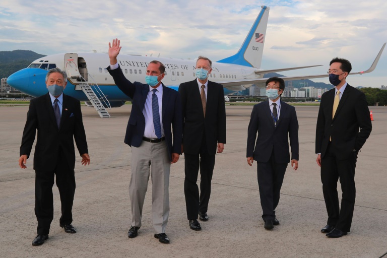 US Health Secretary Alex Azar (second left) waves following his arrival at the Sungshan Airport in Taipei. US Health Secretary Alex Azar (second left) waves following his arrival at the Sungshan Airport in Taipei.