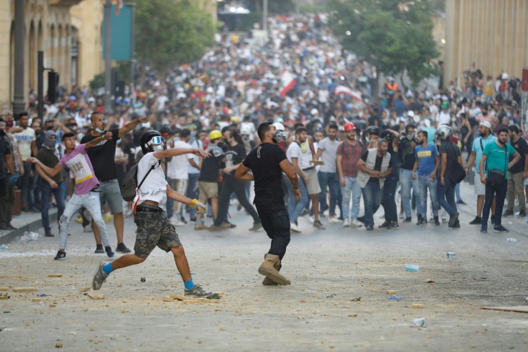 Protesters demand an end to an entrenched political system dominated by sectarian interests and family dynasties. Protesters demand an end to an entrenched political system dominated by sectarian interests and family dynasties.