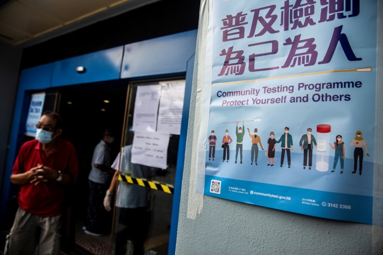 People wait at a Covid-19 coronavirus testing centre in Hong Kong. People wait at a Covid-19 coronavirus testing centre in Hong Kong.