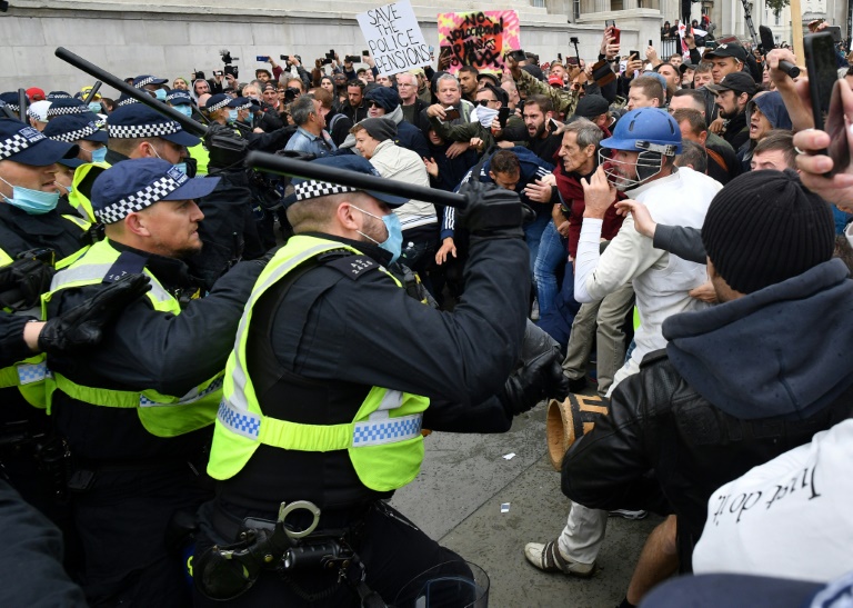 Skirmishes broke out at Trafalgar Square as police moved in with batons. Skirmishes broke out at Trafalgar Square as police moved in with batons.