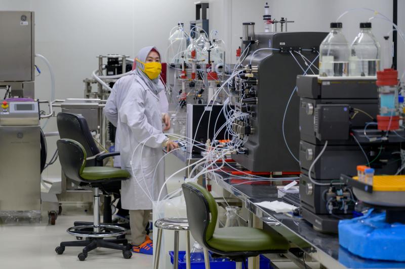 An employee works on the production line of Covid-19 coronavirus vaccines at the Bio Farma Pharmacy, which will produce the vaccine early next year with a production capacity of 250 million vaccines a year, in Bandung, West Java on Aug 12, 2020. (AFP file photo)