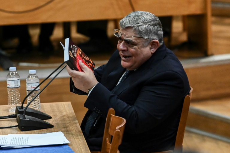 Golden Dawn party leader Nikolaos Michaloliakos, seen here testifying before the court last year, was jailed for 13 years. Golden Dawn party leader Nikolaos Michaloliakos, seen here testifying before the court last year, was jailed for 13 years.