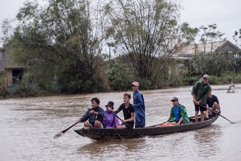 Local residents row a boat to a pickup point for delivering aid packages to residents affected by heavy flooding in Quang An Commune, Thua Thien Hue, Vietnam, on Tuesday. (International Federation of the Red Cross (IFRC)/Handout via REUTERS) Local residents row a boat to a pickup point for delivering aid packages to residents affected by heavy flooding in Quang An Commune, Thua Thien Hue, Vietnam, on Tuesday. (International Federation of the Red Cross (IFRC)/Handout via REUTERS)