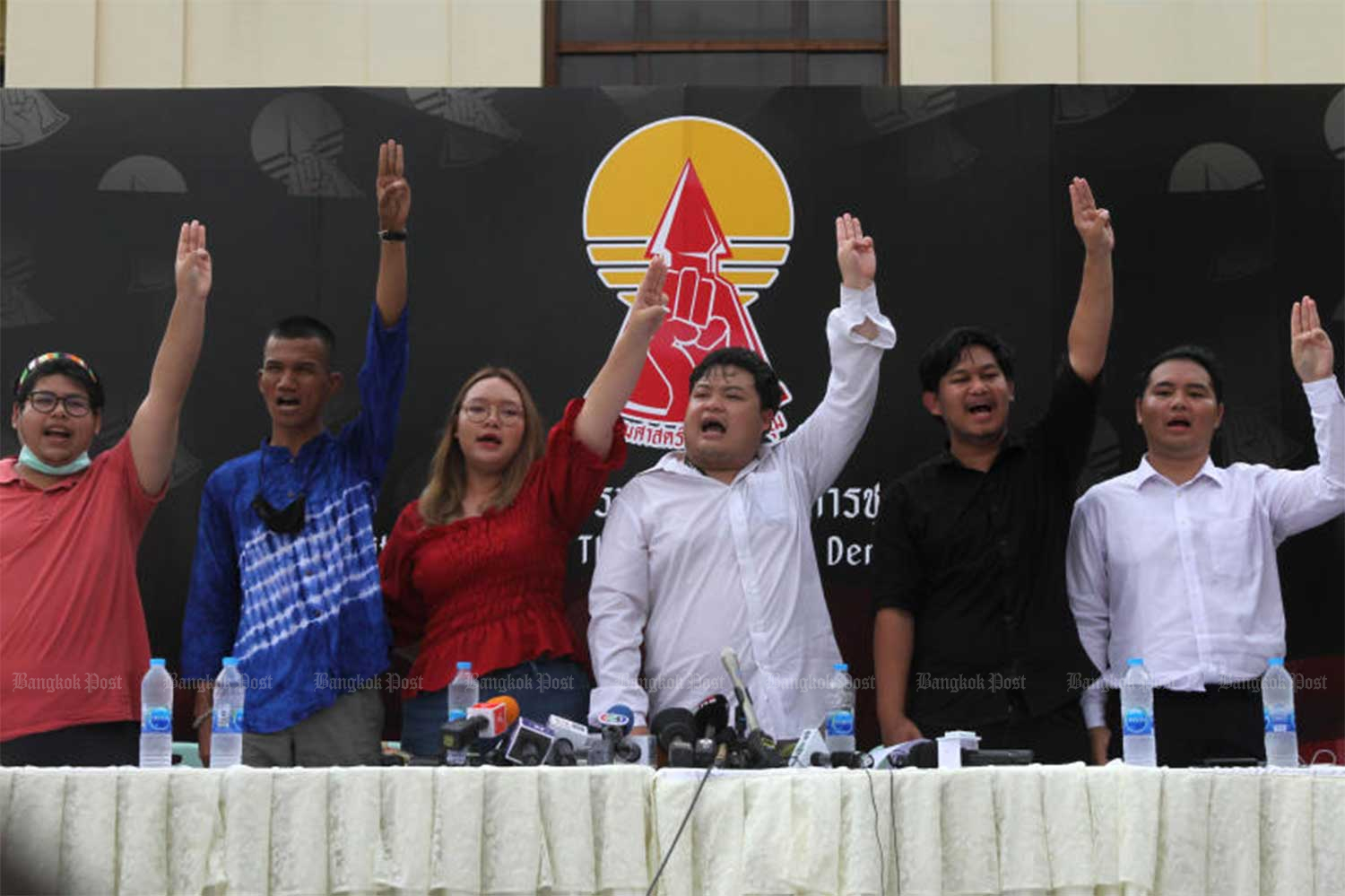 No release: Panupong “Mike” Jadnok (second from left), Panusaya “Rung” Sithijirawattanakul (third) and Parit “Penguin” Chiwarat (fourth) join other activists at a news conference Sept 9 at which they announced plans for a pro-democracy rally on Sept 19. (Post file photo by Wichan Charoenkiatpakul)