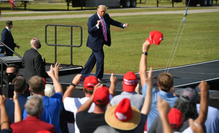 US President Donald Trump dances at the end of a campaign rally in North Carolina on October 24 US President Donald Trump dances at the end of a campaign rally in North Carolina on October 24