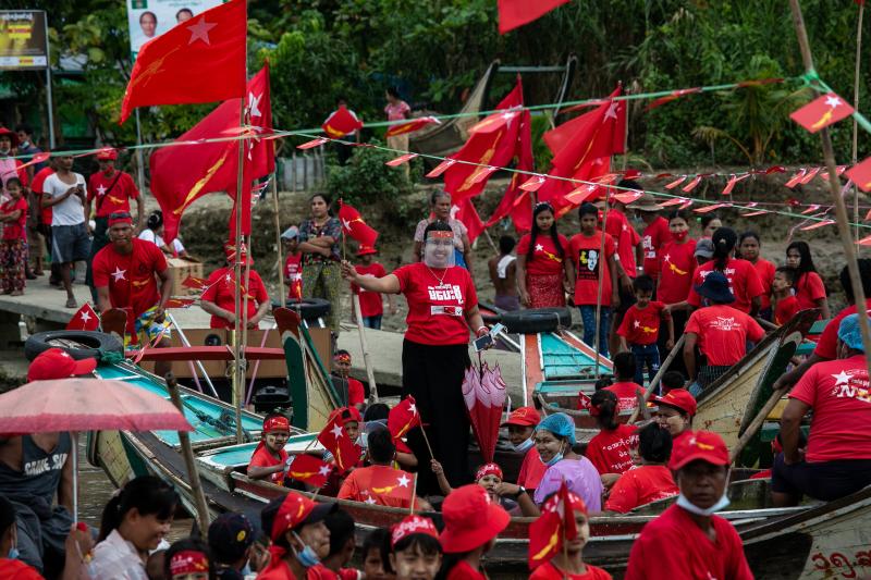 Supporters of the National League for Democracy (NLD) party wave a flag as they ride on wooden boats in the Yangon river during an election campaign rally on the outskirts of Yangon on Wednesday, ahead of next month's elections. (AFP) Supporters of the National League for Democracy (NLD) party wave a flag as they ride on wooden boats in the Yangon river during an election campaign rally on the outskirts of Yangon on Wednesday, ahead of next month's elections. (AFP)