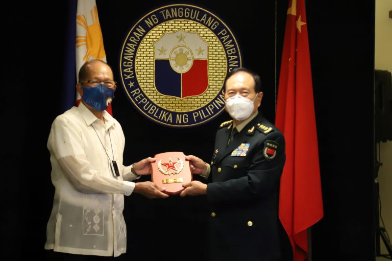 FILE PHOTO: Philippines Defense Secretary Delfin Lorenzana (left) poses for a photo with his Chinese counterpart Wei Fenghe during their bilateral meeting at the Department of National Defense in Manila, Sept 11, 2020. (AFP PHOTO / Department of National Defense FILE PHOTO: Philippines Defense Secretary Delfin Lorenzana (left) poses for a photo with his Chinese counterpart Wei Fenghe during their bilateral meeting at the Department of National Defense in Manila, Sept 11, 2020. (AFP PHOTO / Department of National Defense