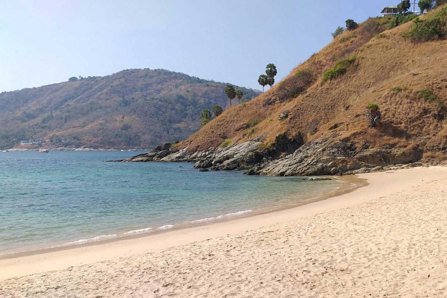 Phuket beach is seen without tourists. The southern island is estimated to lose about 200-320 billion baht's worth of tourism revenue this year due to the pandemic. (Photo by Achadtaya Chuenniran)