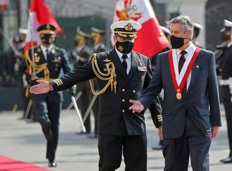 Newly appointed Peruvian interim President Francisco Sagasti is scorted by a military attache upon his arrival at the Congress building in Lima on November 17, 2020, for his swearing-in ceremony Newly appointed Peruvian interim President Francisco Sagasti is scorted by a military attache upon his arrival at the Congress building in Lima on November 17, 2020, for his swearing-in ceremony
