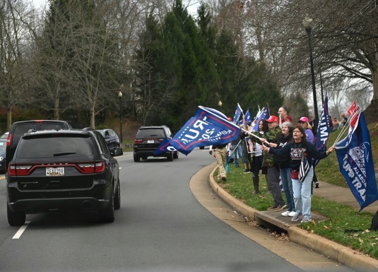 Supporters of US president Donald Trump cheer as he passes in the motorcade after golfing in Sterling, Virginia on Nov 21, 2020. Supporters of US president Donald Trump cheer as he passes in the motorcade after golfing in Sterling, Virginia on Nov 21, 2020.