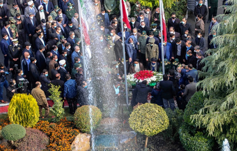 Iranian officials pray over the coffin of top nuclear scientist Mohsen Fakhrizadeh during his funeral in Tehran on Monday, in this picture provided by the country's defence ministry. Iranian officials pray over the coffin of top nuclear scientist Mohsen Fakhrizadeh during his funeral in Tehran on Monday, in this picture provided by the country's defence ministry.