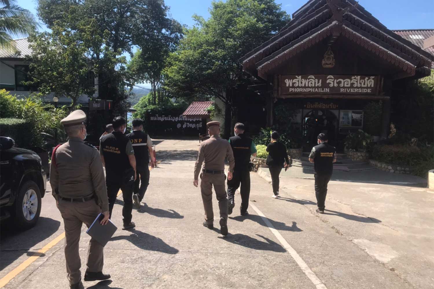 National park officials at the 40 million baht Phornphailin Riverside resort in Kanchanaburi's Sangkhla Buri district on Thursday. It was found to be inside Khao Laem National Park. The owner has refused to demolish the buildings. (Photo: Piyarat Chongcharoen) National park officials at the 40 million baht Phornphailin Riverside resort in Kanchanaburi's Sangkhla Buri district on Thursday. It was found to be inside Khao Laem National Park. The owner has refused to demolish the buildings. (Photo: Piyarat Chongcharoen)