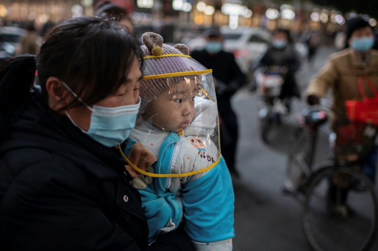 WHO team arrives in Wuhan as China reports first virus death in months