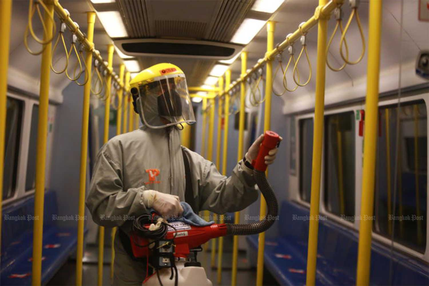 A health worker sprays disinfectant in the carriages of an Airport Rail Link train on Saturday as Thailand reports 230 new cases with one more Covid death. (Photo by Somchai Poomlard)