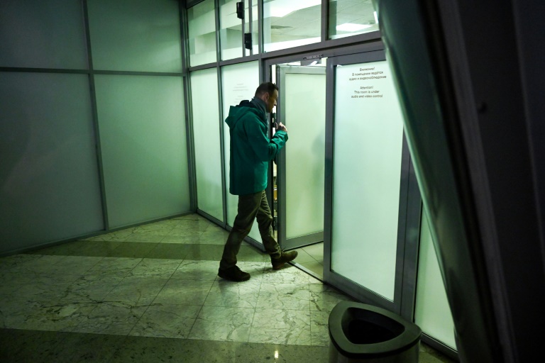 Russian opposition leader Alexei Navalny enters a room at the passport control point at Moscow's Sheremetyevo airport before he was taken away. Russian opposition leader Alexei Navalny enters a room at the passport control point at Moscow's Sheremetyevo airport before he was taken away.