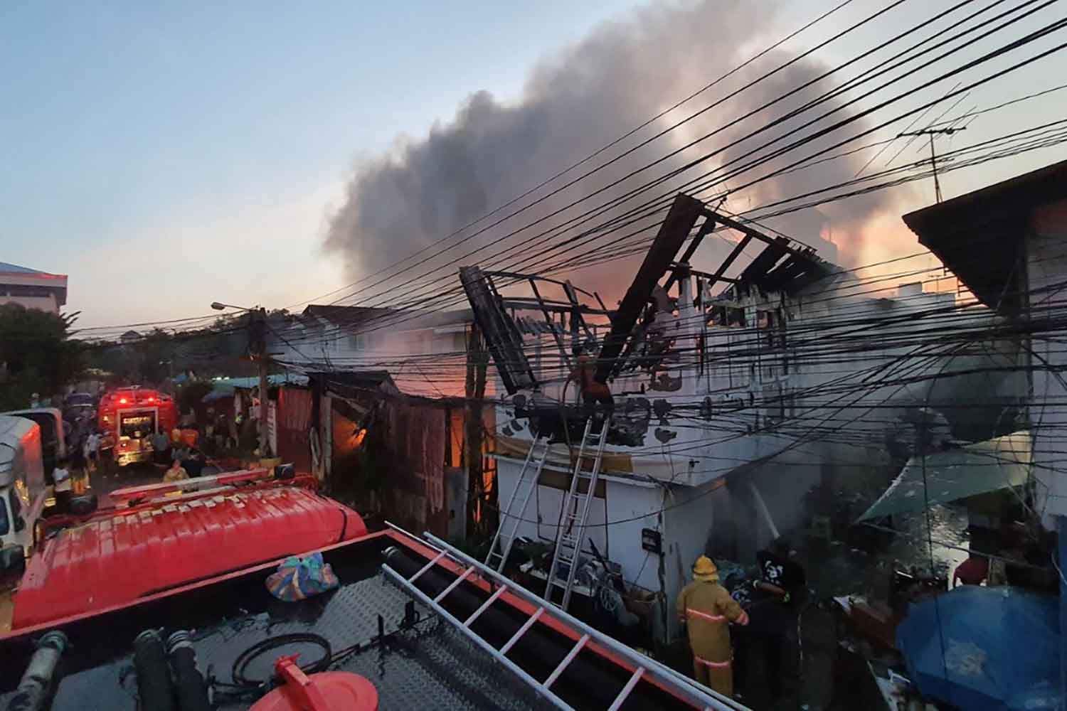 Fire guts pillow factory, adjacent house