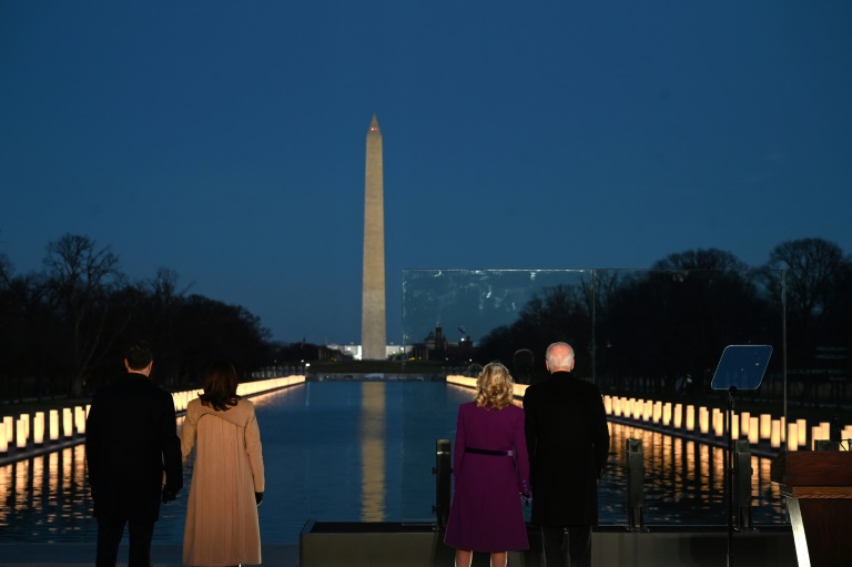 President-elect Joe Biden (right) and incoming First Lady Jill Biden watch as a Covid-19 memorial is lit in Washington, DC.