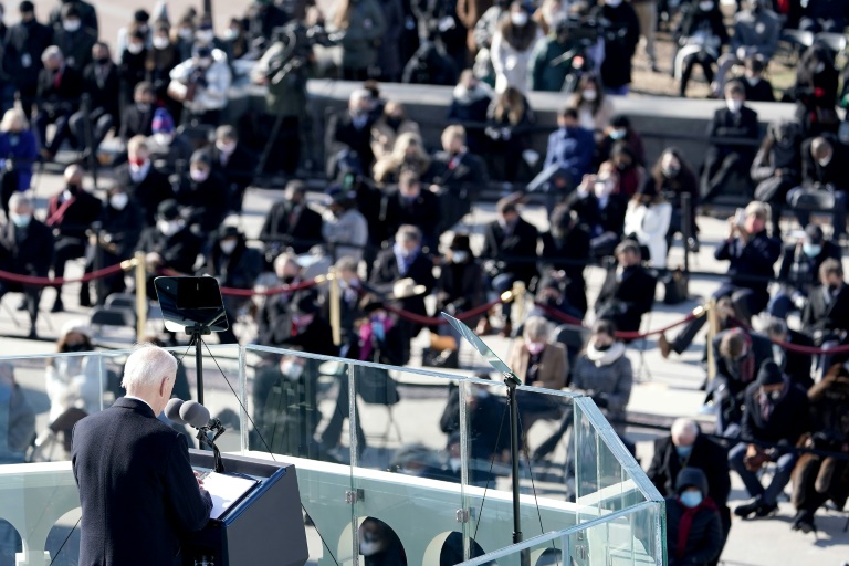 US President Joe Biden bows his head in prayer to honor those lost due Covid-19 as he gives his inaugural address during the 59th Presidential Inauguration ceremony on January 20, 2021, at the US Capitol in Washington, DC. US President Joe Biden bows his head in prayer to honor those lost due Covid-19 as he gives his inaugural address during the 59th Presidential Inauguration ceremony on January 20, 2021, at the US Capitol in Washington, DC.