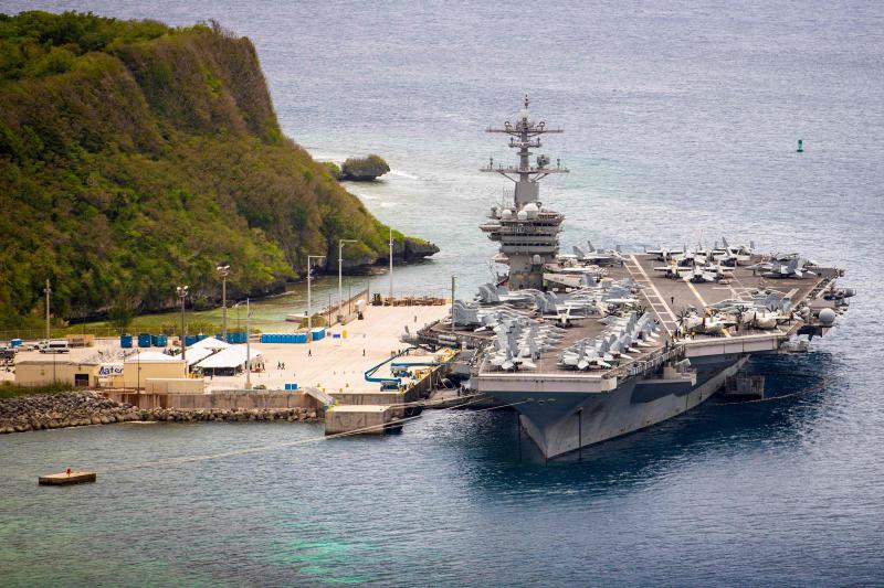 This file US Navy photo shows the aircraft carrier USS Theodore Roosevelt (CVN 71) moored at Naval Base Guam on May 15, 2020. This file US Navy photo shows the aircraft carrier USS Theodore Roosevelt (CVN 71) moored at Naval Base Guam on May 15, 2020.