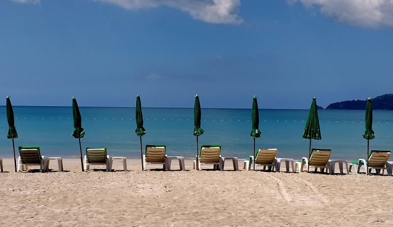 Beach chairs lie empty on the resort island of Phuket as even local tourists have disappeared in the wake of the recent outbreak of Covid-19, on Jan 25, 2021. (Bangkok Post file photo)