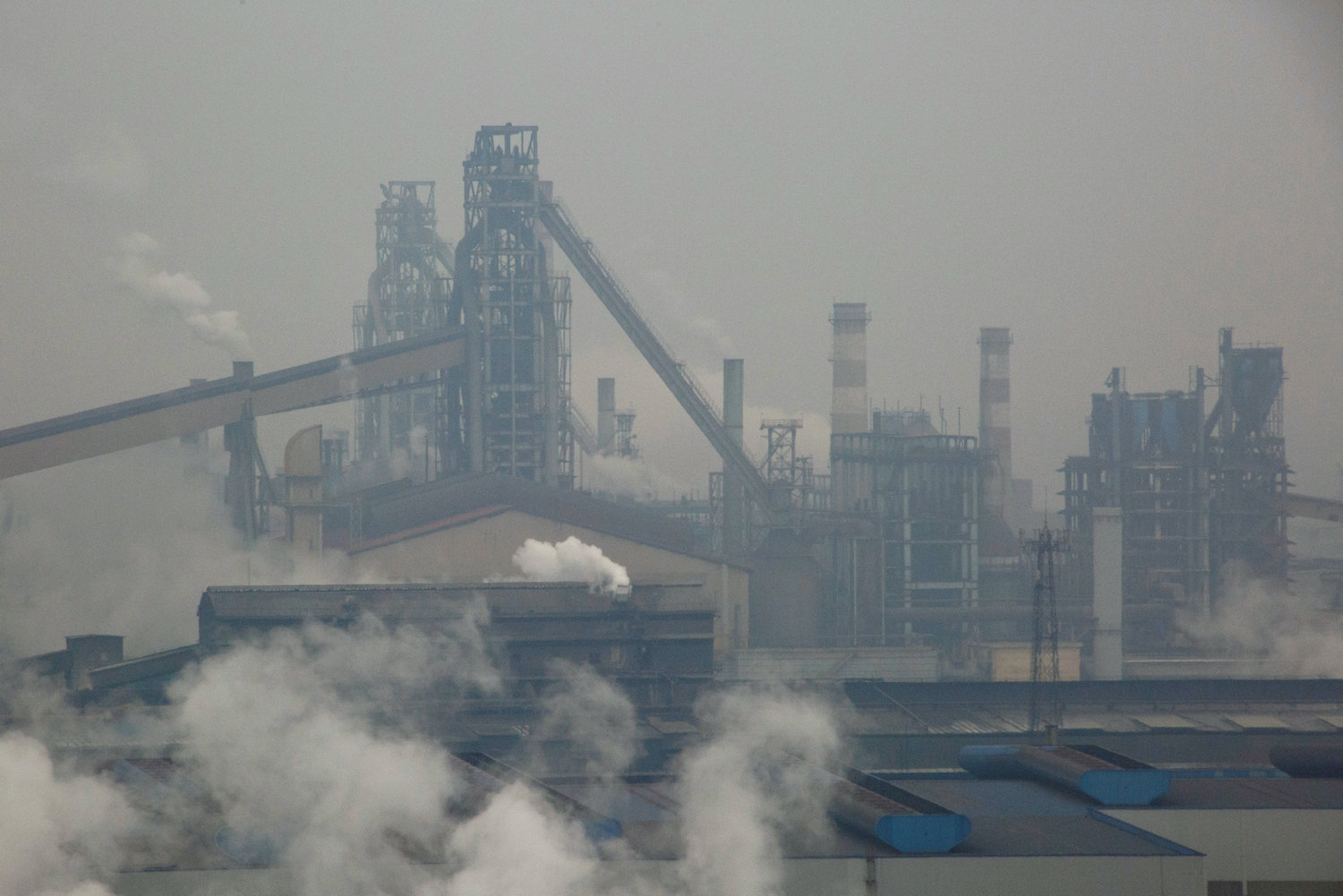 Smoke and steam rise from a steel plant in Anyang in Henan province of China. (Reuters File Photo) Smoke and steam rise from a steel plant in Anyang in Henan province of China. (Reuters File Photo)