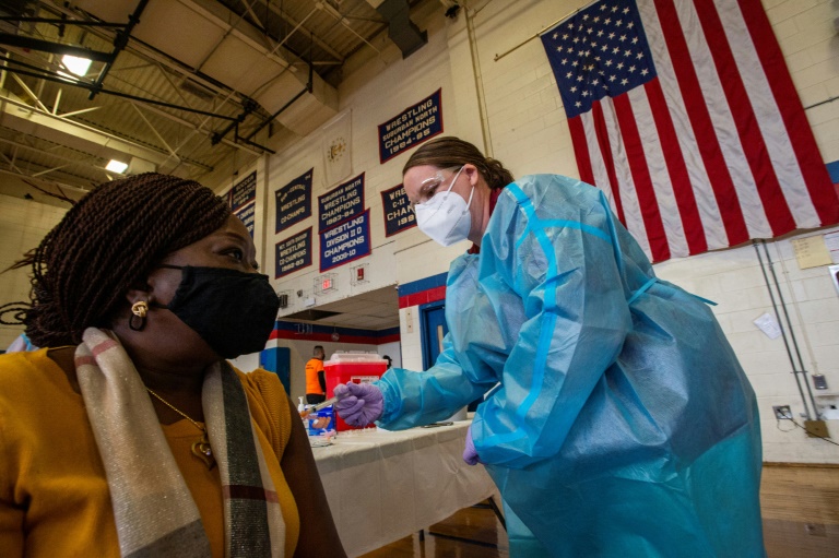 Doris Norman gets the Covid-19 vaccine in the United States, where minorities have died from the virus at higher rates than whites. Doris Norman gets the Covid-19 vaccine in the United States, where minorities have died from the virus at higher rates than whites.