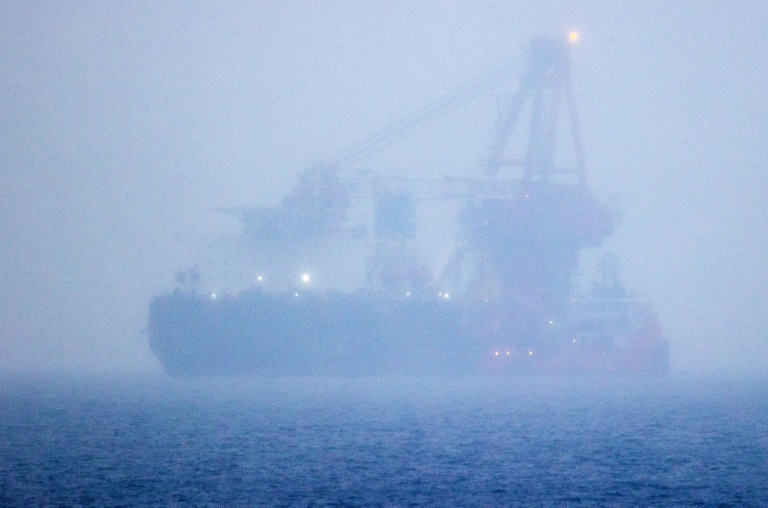 The Russian pipe-laying ship Fortuna, which has been hit by US sanctions, is seen in the fog anchored in the Baltic Sea off the port of Rostock in Germany in January 2021 during work on the controversial Nord Stream 2 gas pipeline. The Russian pipe-laying ship Fortuna, which has been hit by US sanctions, is seen in the fog anchored in the Baltic Sea off the port of Rostock in Germany in January 2021 during work on the controversial Nord Stream 2 gas pipeline.