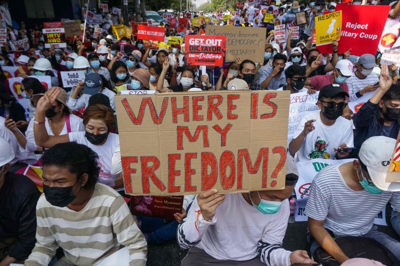 Protesters hold signs as they take part in a demonstration against the military coup in front of the Indonesian embassy in Yangon, Myanmar on Wednesday. (AFP photo)