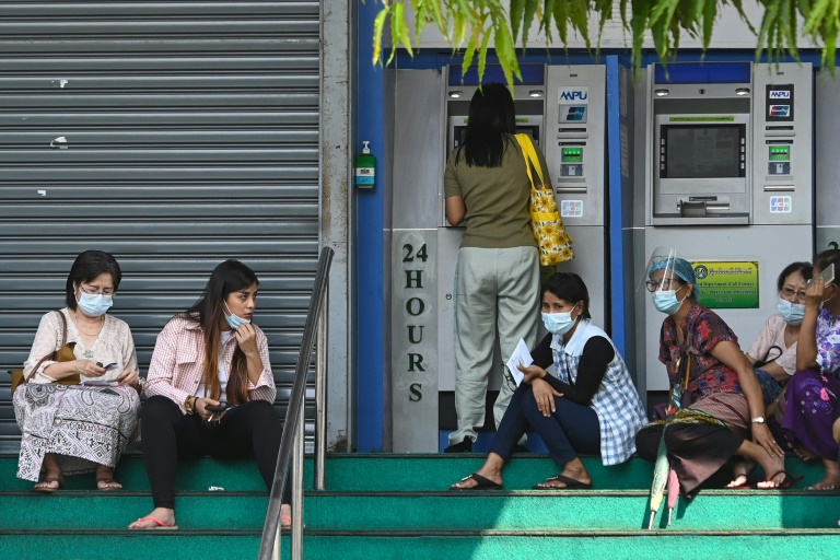 People in Myanmar have been queueing anxiously at banks after the coup as a strict new limit on daily withdrawals fuelled rumours of a money shortage.