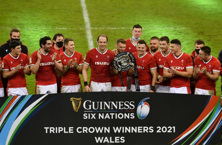 Triple joy - Wales captain Alun Wyn Jones (centre) and fly-half Dan Biggar (centre right) hold the Triple Crown trophy after a 40-24 win over England Triple joy - Wales captain Alun Wyn Jones (centre) and fly-half Dan Biggar (centre right) hold the Triple Crown trophy after a 40-24 win over England